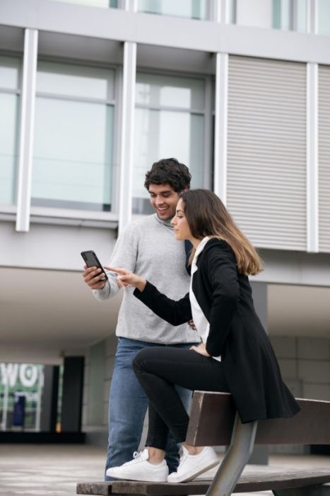 blivale_image_homepage_ful_shot_people_with_smartphone BLIVALE | International eSIM and SIM Card for trips abroad